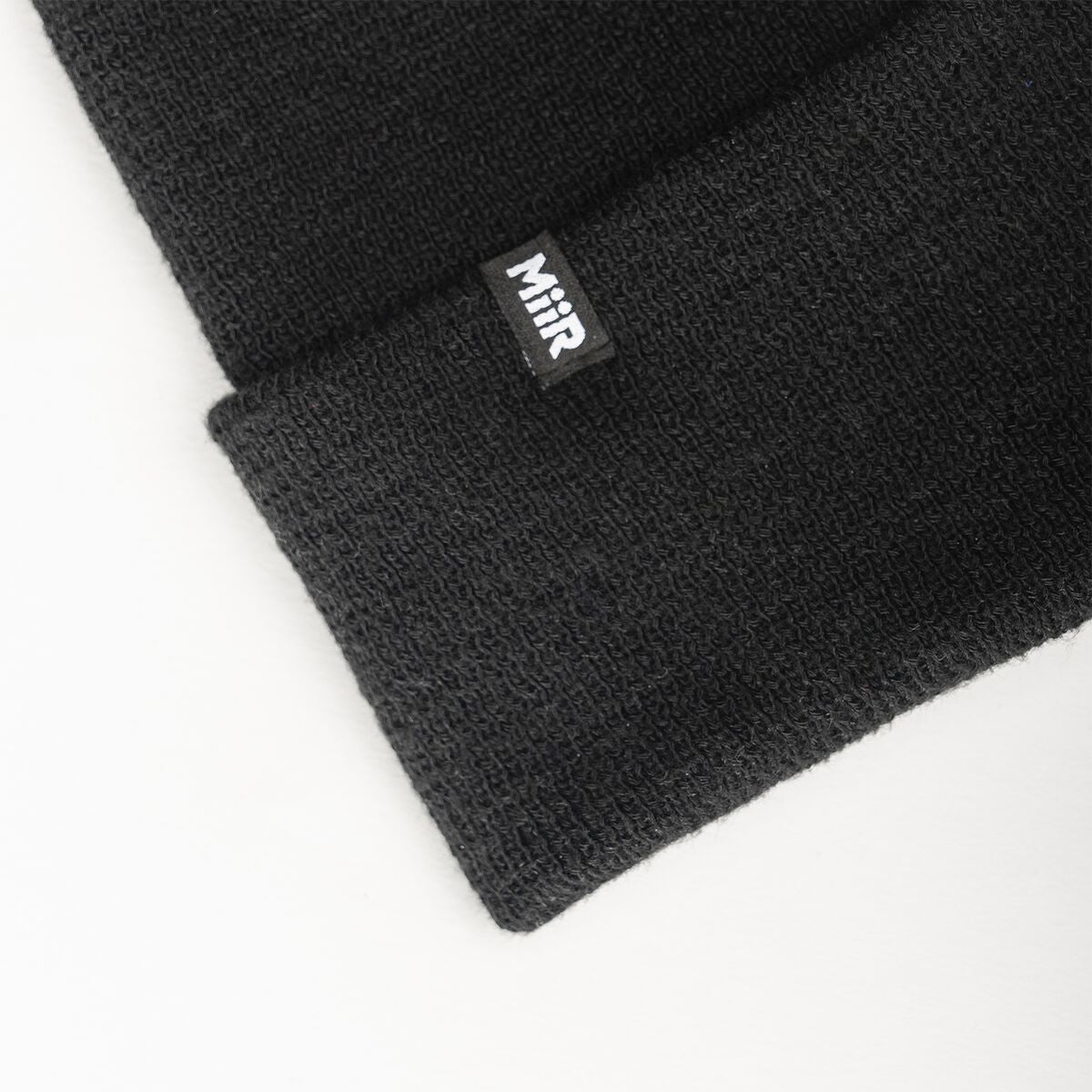recycled-poly-fine-knit-beanie-h7 WebPDP-RecycledPolyFineKnitBeanie_Studio_TagDetail_Black__BNE005002OS.jpg