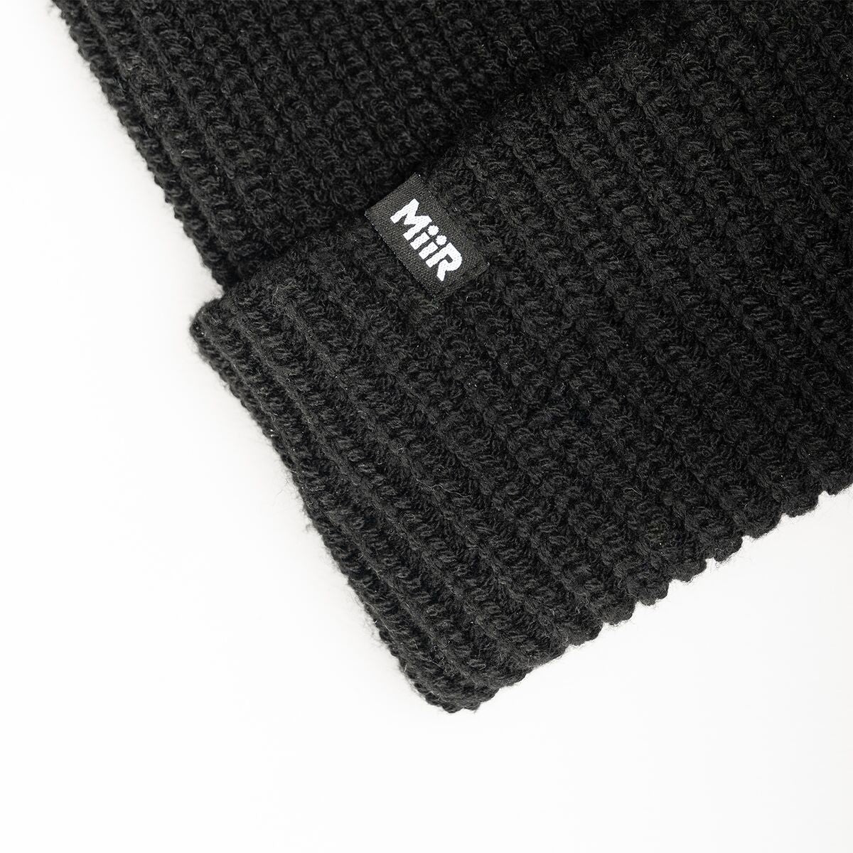 recycled-poly-rib-beanie-r9 WebPDP-RecycledPolyRibBeanie_Studio_TagDetail_Black__BNE002002OS.jpg